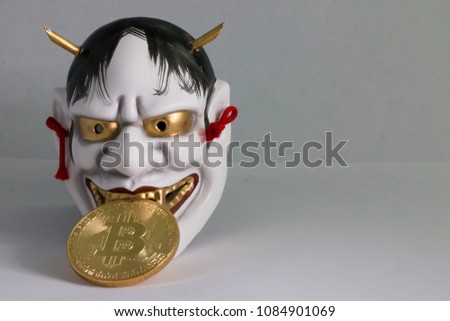 Bitcoin Coin with a Japanese Hannya Mask.