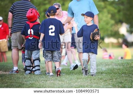 High Five line after a children's  baseball game Royalty-Free Stock Photo #1084903571