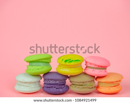 colorful macaron or macaroon on pink background copy space