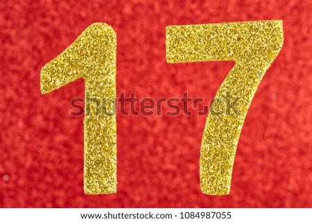 Number seventeen golden color over a red background. Anniversary. Horizontal