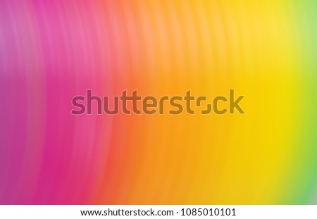 Abstract blurred gradient background in bright rainbow colors.