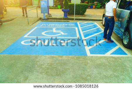 Handicapped Parking, Disabled parking sign in filling station, Thailand. Parking signs for the disabled on parking floor.