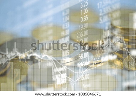 Double exposure of coin stack with stock market screen chart board and candle stick for financial business and investor analysis concept idea.