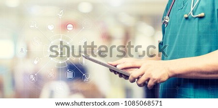 Medicine doctor or medical students with stethoscope using digital tablet laptop,Health Check with digital system support for patient with medical icon at hospital, Medical network technology concept.