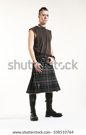 Portrait of a young punk with scottish skirt