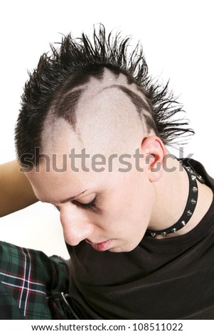 closeup of man, head down, punk hairstyle