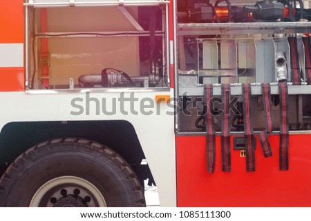 red fire truck with fire fighting equipment
