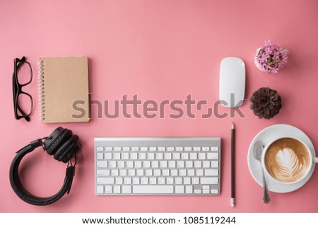 business, education concept. Office supplies, blank screen notebook eyeglasses on a pink table.top view.