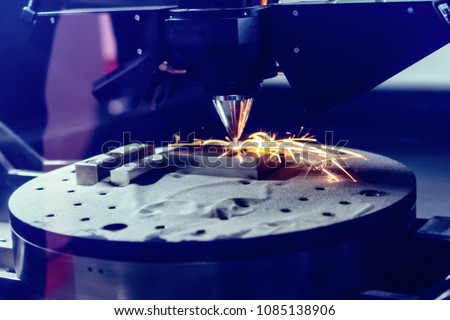3D metal printer produces a steel part. A revolutionary technology for sintering metal parts. Soft focus. Royalty-Free Stock Photo #1085138906