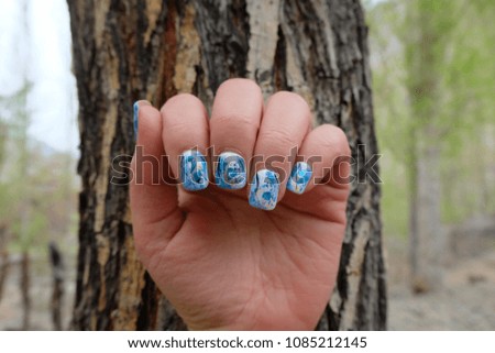 Close-up of beautiful blue and white gel nail polish