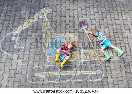 Two little kid boys with excavator chalk picture