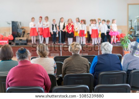 image of blur kid 's show on stage at school , for background usage.