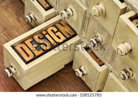 design concept - a word in vintage letterpress wood type and primitive rustic wooden apothecary drawer cabinet