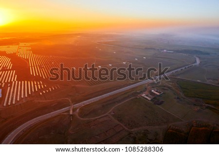 At sunrise, aerial new energy solar photovoltaic