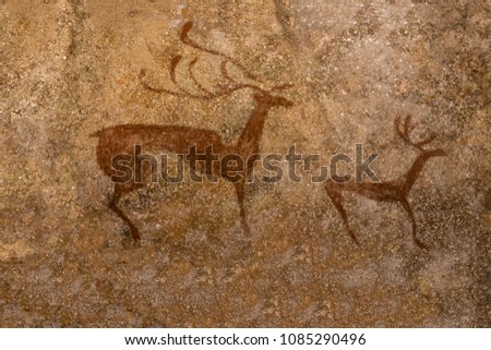 image of the ancient deer on the wall of the cave ocher. ancient history, archeology.