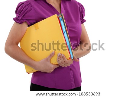 A cropped picture of a businesswoman holding  a file.