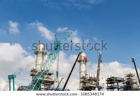 Lots of tower Construction site with cranes and building with blue sky background,scaffolding for construction factory
