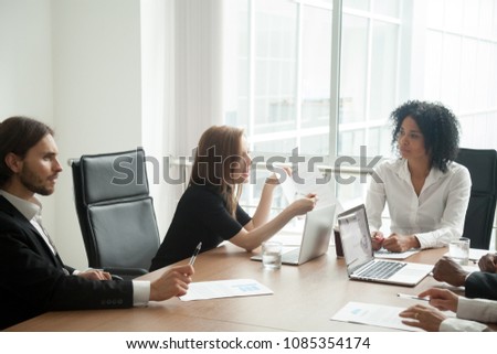 Deceived dissatisfied businesswoman having claims arguing about bad business contract terms disputing at meeting with diverse lawyer and partners demanding compensation, legal fight and fraud concept Royalty-Free Stock Photo #1085354174