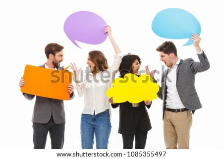 Portrait of a group of angry multiracial business people holding empty speech bubbles isolated over white background