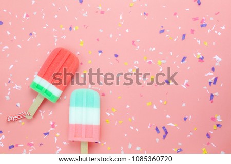 Table top view aerial image of food for summer holiday background concept.Flat lay ice cream pop stick on modern rustic pink paper wallpaper.Copy space for creative design for add text and content.