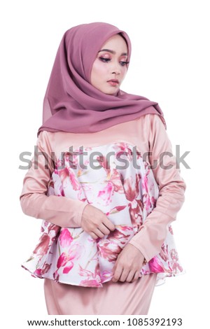 portrait of pretty asian muslim woman feeling sad