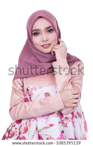 portrait of pretty asian muslim woman having fun