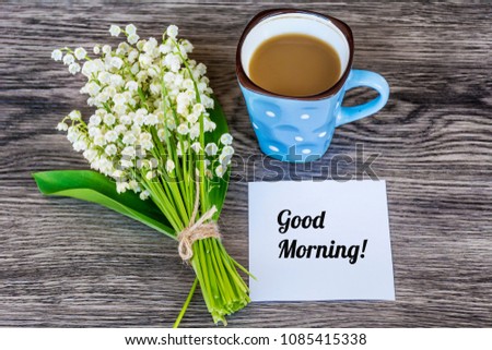 Bouquet of Lily of the Valley and Cup of Coffee for  Good Morning .Spring Morning Concept