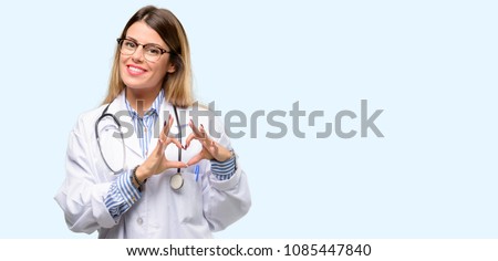 Young doctor woman, medical professional happy showing love with hands in heart shape expressing healthy and marriage symbol