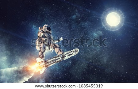 Astronaut surfing dark sky. Mixed media Royalty-Free Stock Photo #1085455319