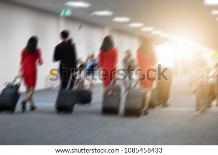 Airline Passengers in an International Airport motion blur