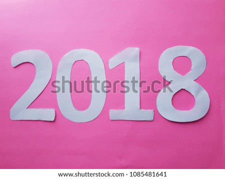 number 2018 in white with background in  pink color