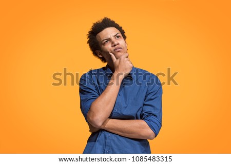 Remember all. Let me think. Doubt concept. Doubtful, thoughtful man remembering something. Young emotional afro man. Human emotions, facial expression concept. Studio. Isolated on trendy blue. Front Royalty-Free Stock Photo #1085483315