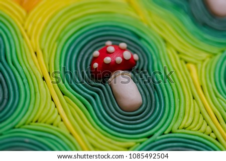 Aura of the magic mushroom. Desktop wallpapers. Picture of colored plasticine handmade. Macro photo.
