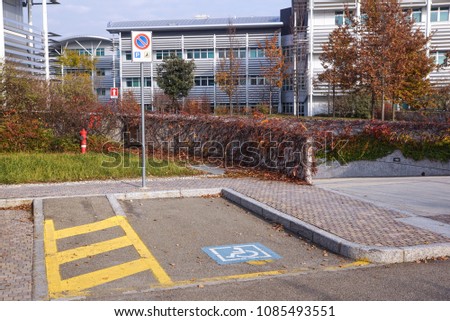 handicapped sign mark parking spot, disabled parking permit sign on pole with convenience store in gas station area background, copy space