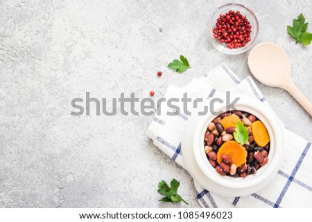 Instant pot sausage beans on concrete background. Top view, space for text. 
