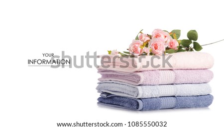A stack set of towels pink blue flowers pattern on a white background isolation