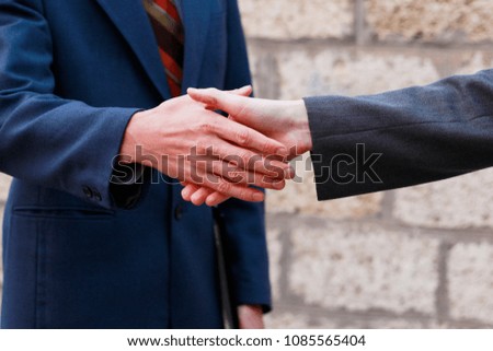 Business partnership handshake concept. Photo two coworkers handshaking process. Work contract