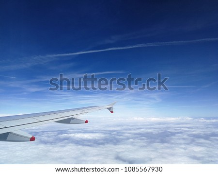 Morning sunrise with wing of an airplane above the clouds. picture for add text message