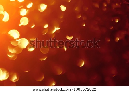 Abstract xmas gold bokeh or glitters. Christmas festive lights. Golden light  background. Defocused bokeh  particles. Template for design