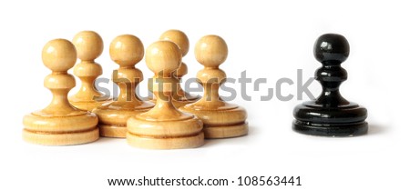 Racism between black and white pawns isolated on white background Royalty-Free Stock Photo #108563441