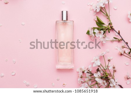 Floral perfume bottle with orchid flowers Royalty-Free Stock Photo #1085651918
