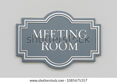 Meeting room sign on wall
