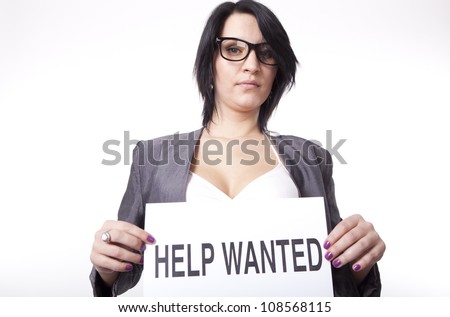 Portrait of a young attractive woman with a sign help wanted.