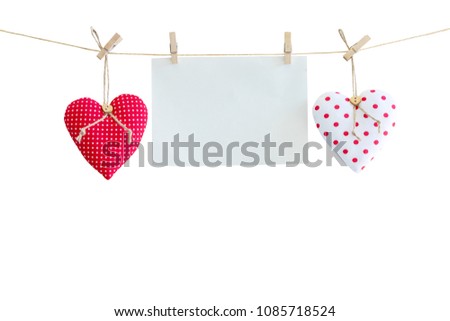Heart and balnk paper hanging on isolated white with clipping path.