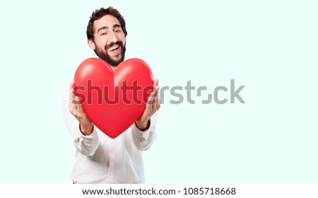 young crazy or mad man, expressive face, holding a heart symbol. love concept