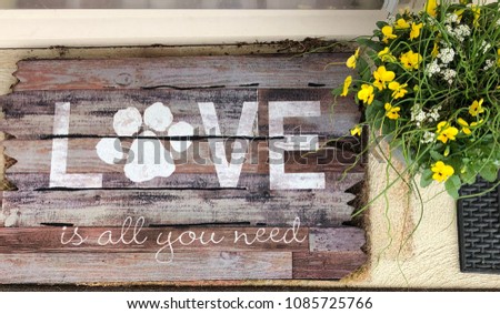 Love is all you need doormat with paw print and flowers