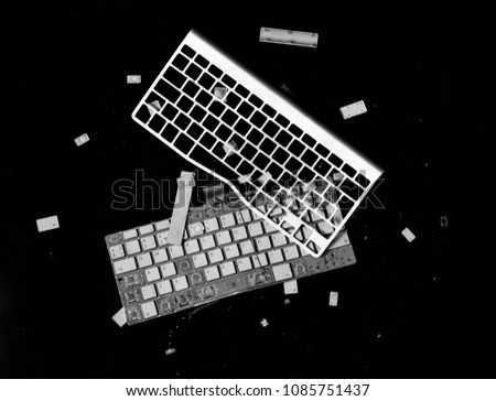 crashed keyboard isolated on black background