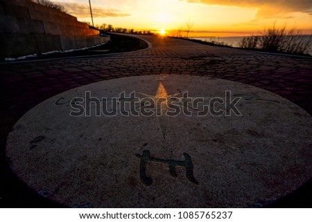 Sunset over the compass at Lakwood Park, Ohio