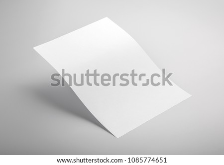 Photo of white letterhead isolated on gray background. Template for branding identity. For graphic designers presentations and portfolios. Letterhead isolated on gray. White letterhead mock-up.  Royalty-Free Stock Photo #1085774651