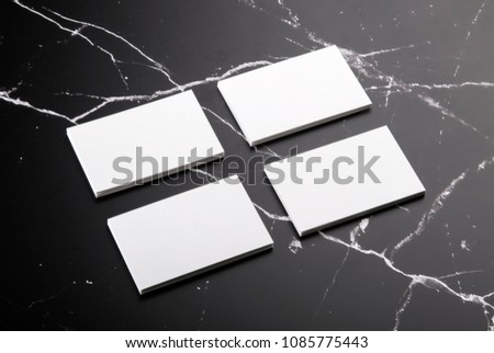 Photo of white business cards on marble. Template for branding identity isolated on marble background. For graphic designers presentations and portfolios marble premium luxury mock-up. 
